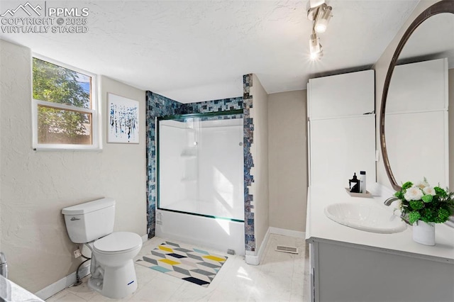 109 S 24th St, Colorado Springs, CO 80904 - full bath featuring double vanity, combined bath / shower with glass door, and rail lighting