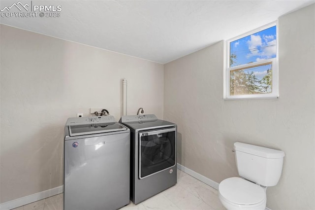 109 S 24th St, Colorado Springs, CO 80904 - laundry room with independent washer and dryer and light marble finish flooring