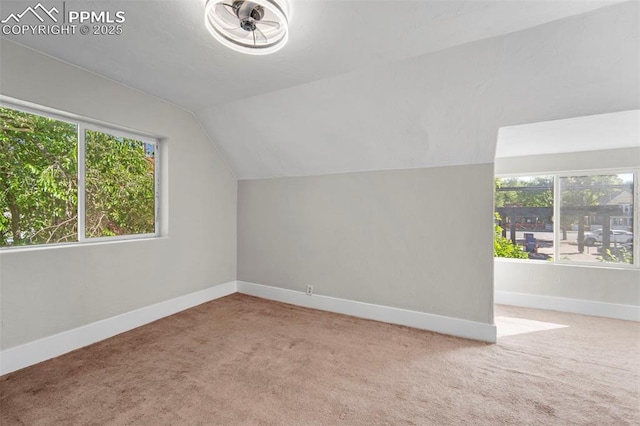 109 S 24th St, Colorado Springs, CO 80904 - additional living space featuring healthy amount of natural light, carpet flooring, and lofted ceiling
