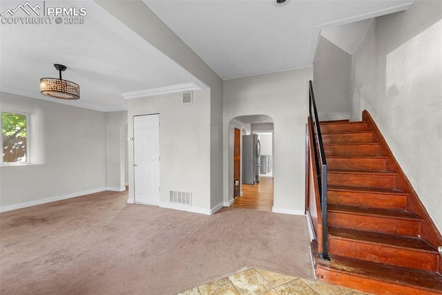 109 S 24th St, Colorado Springs, CO 80904 - stairway with arched walkways and carpet flooring