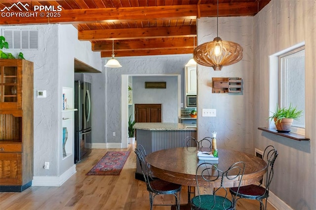 4440 Heizer St, Cascade, CO 80809 - dining space with a wood ceiling with exposed beams and light wood-style flooring