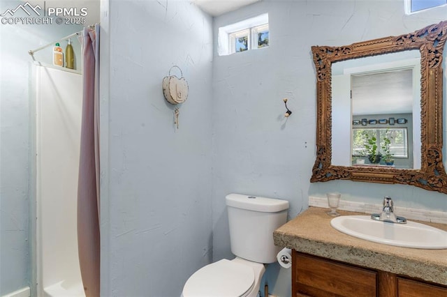4440 Heizer St, Cascade, CO 80809 - bathroom with vanity, curtained shower, and plenty of natural light