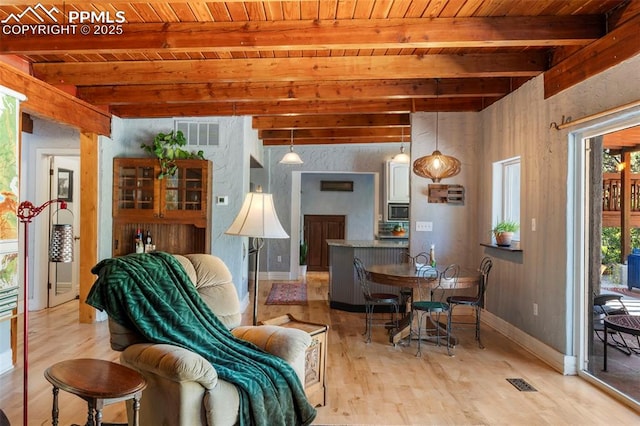 4440 Heizer St, Cascade, CO 80809 - dining room featuring a wooden ceiling with exposed beams and light wood-style floors
