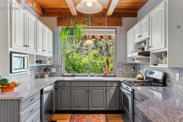 4440 Heizer St, Cascade, CO 80809 - kitchen with gray cabinetry, stainless steel appliances, a wood ceiling with exposed beams, open shelves, and tasteful backsplash