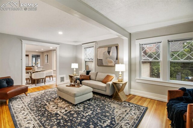 122 E Jefferson St, Colorado Springs, CO 80907 - living room with hardwood / wood-style flooring and baseboards