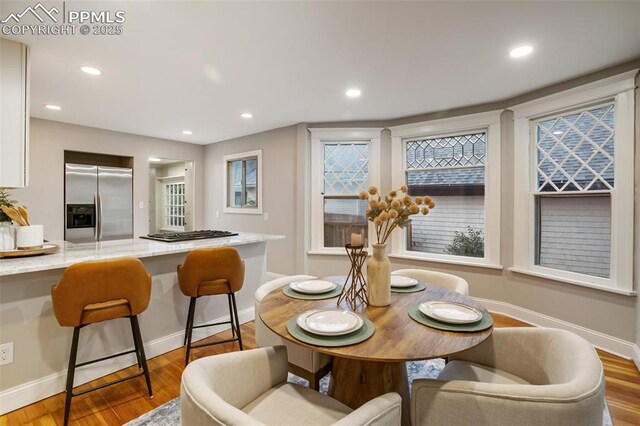 122 E Jefferson St, Colorado Springs, CO 80907 - dining room featuring light wood-type flooring, recessed lighting, and healthy amount of natural light