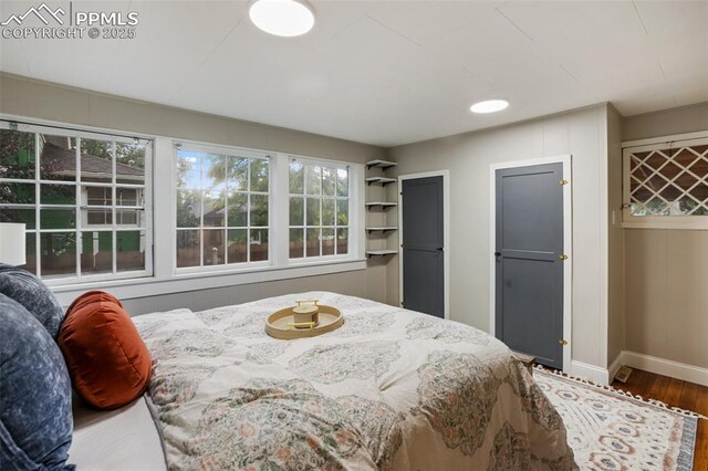 122 E Jefferson St, Colorado Springs, CO 80907 - bedroom featuring wood finished floors and baseboards