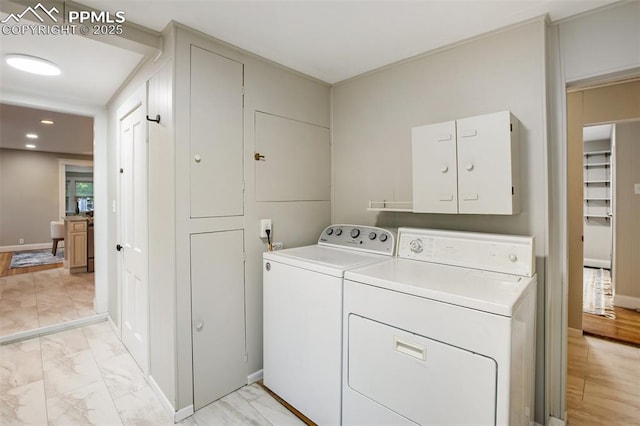 122 E Jefferson St, Colorado Springs, CO 80907 - laundry area with washing machine and clothes dryer, cabinet space, light marble finish floors, and recessed lighting