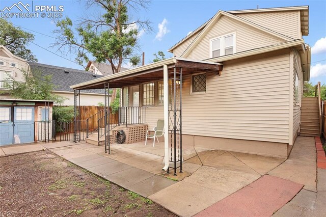 122 E Jefferson St, Colorado Springs, CO 80907 - rear view of house with a patio