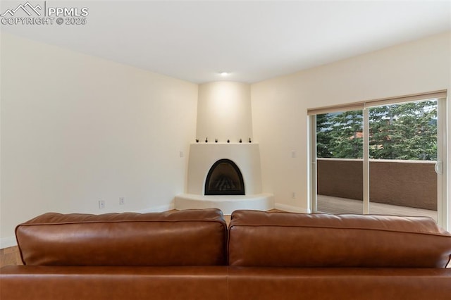 3219 W Pikes Peak Ave, Colorado Springs, CO 80904 - living room featuring a fireplace with raised hearth and wood finished floors