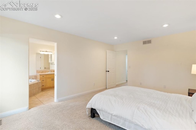3219 W Pikes Peak Ave, Colorado Springs, CO 80904 - bedroom with light colored carpet, recessed lighting, ensuite bathroom, and light tile patterned flooring