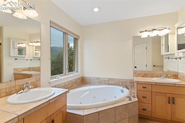 3219 W Pikes Peak Ave, Colorado Springs, CO 80904 - bathroom featuring a whirlpool tub and two vanities