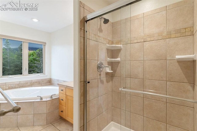 3219 W Pikes Peak Ave, Colorado Springs, CO 80904 - full bathroom featuring a stall shower, a garden tub, and vanity