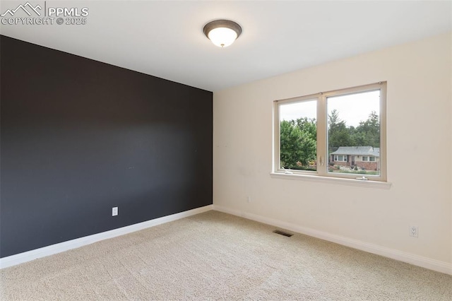 3219 W Pikes Peak Ave, Colorado Springs, CO 80904 - carpeted empty room with baseboards