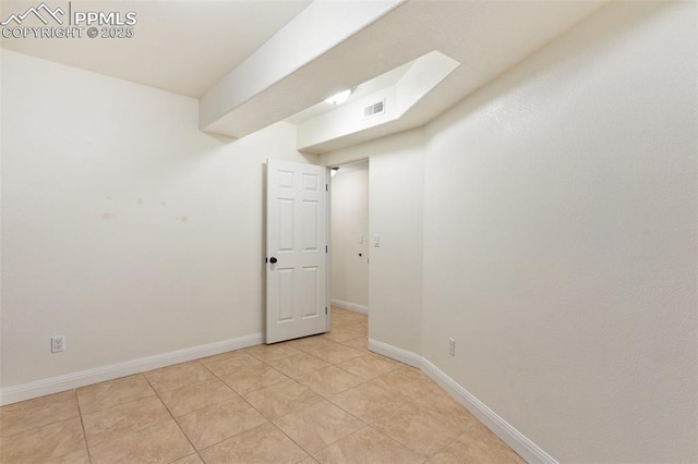 3219 W Pikes Peak Ave, Colorado Springs, CO 80904 - spare room featuring baseboards and light tile patterned flooring