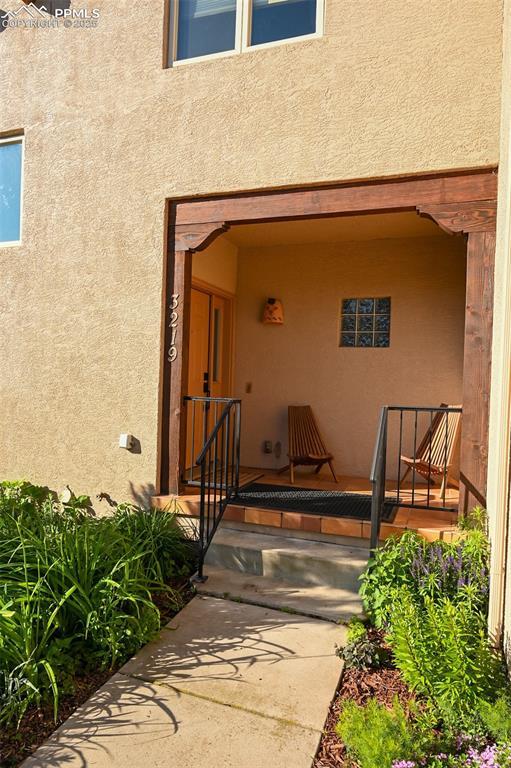 3219 W Pikes Peak Ave, Colorado Springs, CO 80904 - entrance to property featuring stucco siding