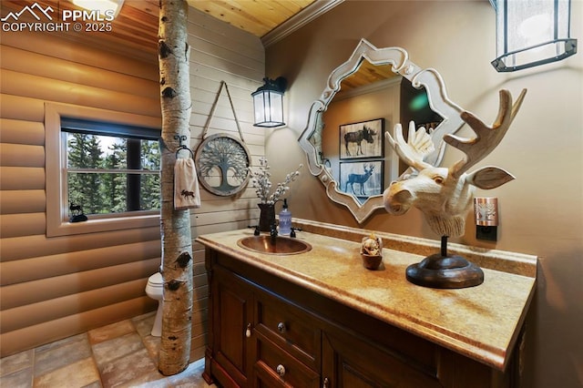 101 Daniwood Grv, Florissant, CO 80816 - bathroom featuring vanity, log walls, wooden ceiling, and ornamental molding
