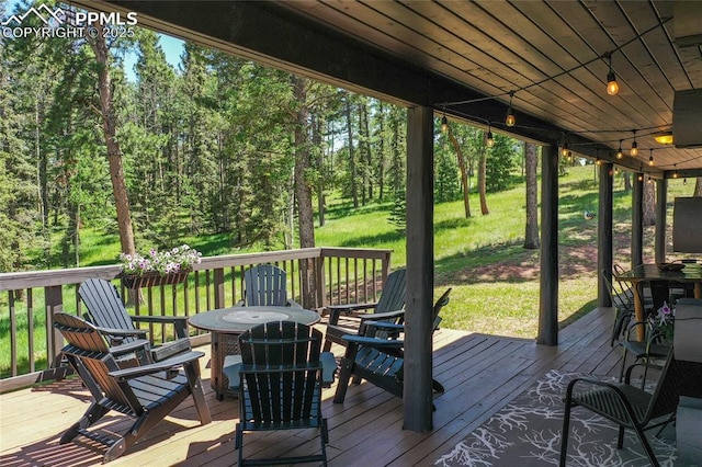 101 Daniwood Grv, Florissant, CO 80816 - wooden deck with a yard and outdoor dining area