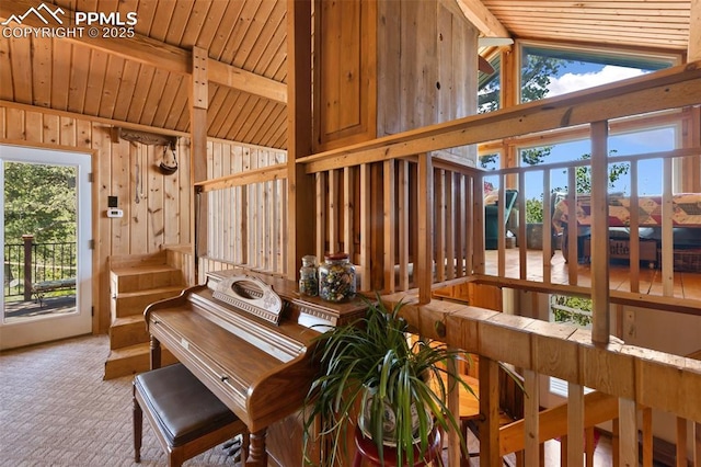 47 Red Cloud Rd, Woodland Park, CO 80863 - detailed view of a wooden ceiling with exposed beams, carpet floors, and wooden walls