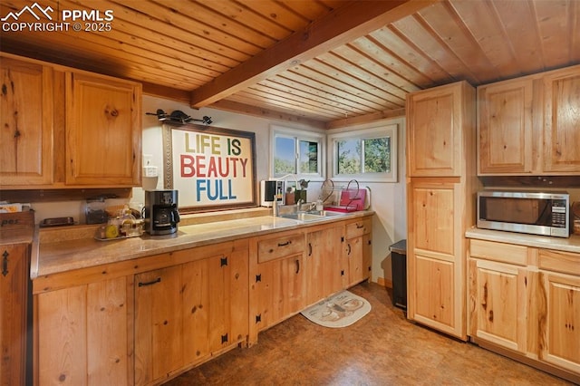 47 Red Cloud Rd, Woodland Park, CO 80863 - kitchen featuring stainless steel microwave, wood ceiling, light brown cabinets, light countertops, and light floors