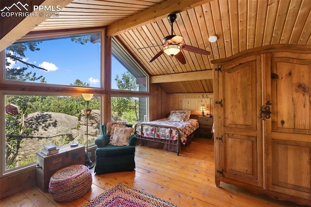 47 Red Cloud Rd, Woodland Park, CO 80863 - bedroom featuring light wood-style flooring, wooden ceiling, and wooden walls