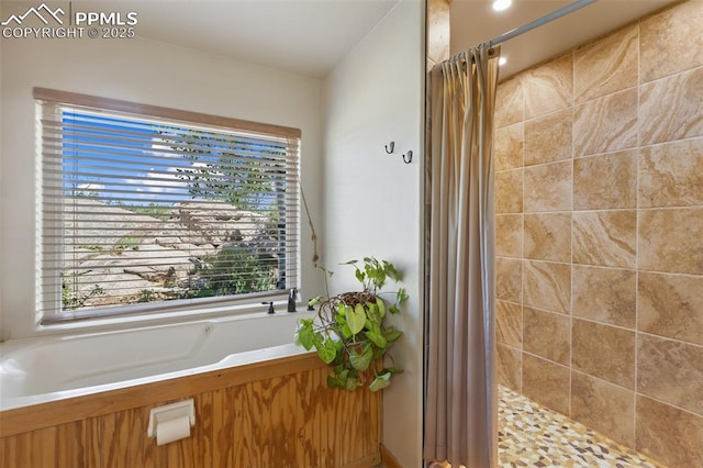 47 Red Cloud Rd, Woodland Park, CO 80863 - bathroom with a tile shower and a garden tub
