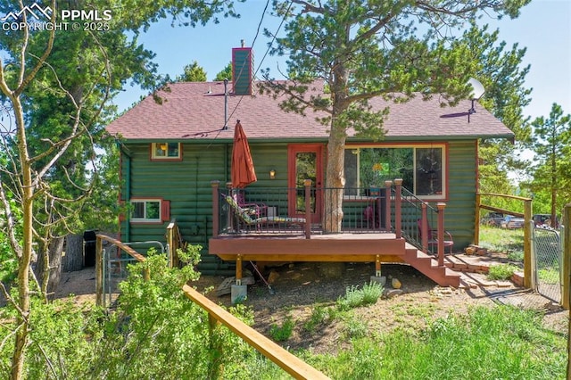 47 Red Cloud Rd, Woodland Park, CO 80863 - rear view of property with a deck, a chimney, and roof with shingles