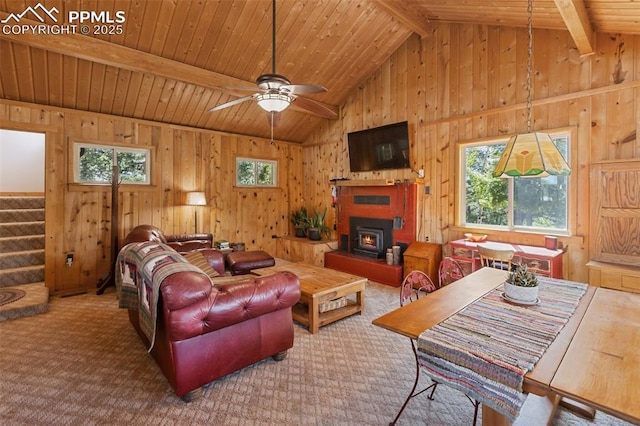 47 Red Cloud Rd, Woodland Park, CO 80863 - carpeted living area featuring wooden ceiling, wood walls, stairway, and ceiling fan