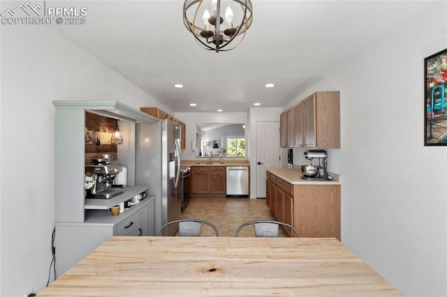 6534 Harvey Ln, Colorado Springs, CO 80923 - kitchen with stainless steel appliances, a chandelier, light countertops, and recessed lighting