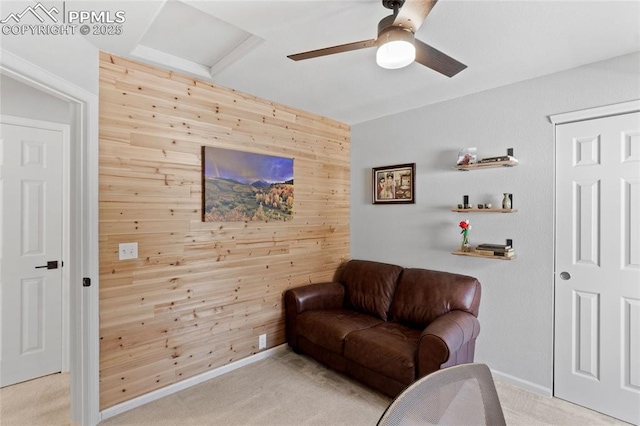 6534 Harvey Ln, Colorado Springs, CO 80923 - sitting room with wood walls, a ceiling fan, light colored carpet, attic access, and an accent wall