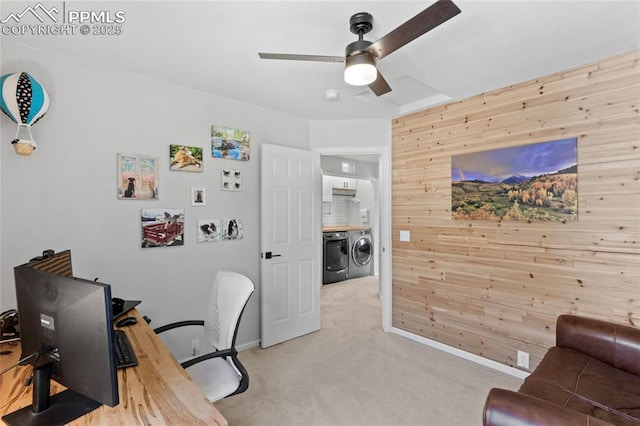 6534 Harvey Ln, Colorado Springs, CO 80923 - office area featuring wood walls, a ceiling fan, washing machine and clothes dryer, and light carpet