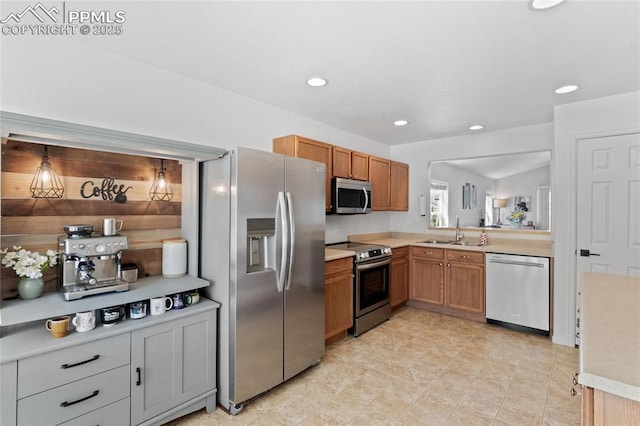 6534 Harvey Ln, Colorado Springs, CO 80923 - kitchen featuring stainless steel appliances, light countertops, brown cabinetry, and recessed lighting