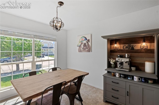 6534 Harvey Ln, Colorado Springs, CO 80923 - dining space with a chandelier and baseboards