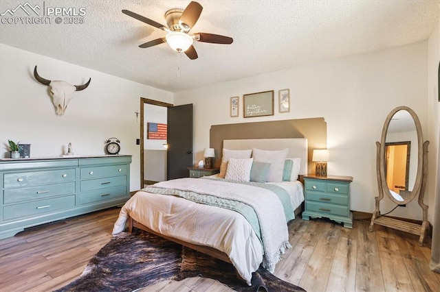 2722 Front Royal Dr, Colorado Springs, CO 80919 - bedroom featuring wood finished floors, a textured ceiling, and a ceiling fan