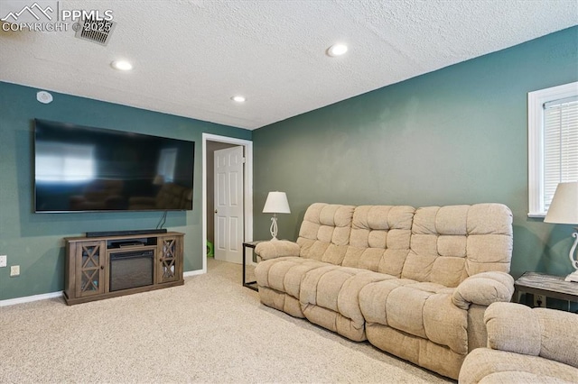 2722 Front Royal Dr, Colorado Springs, CO 80919 - living room with carpet floors, a textured ceiling, and recessed lighting