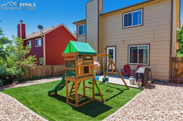 2722 Front Royal Dr, Colorado Springs, CO 80919 - view of play area with a fenced backyard and a patio area