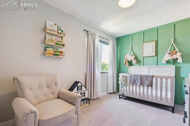 2722 Front Royal Dr, Colorado Springs, CO 80919 - bedroom with a nursery area, carpet floors, and a textured ceiling