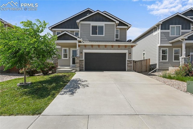 9744 Rubicon Dr, Colorado Springs, CO 80925 - craftsman inspired home featuring an attached garage, driveway, board and batten siding, and stone siding