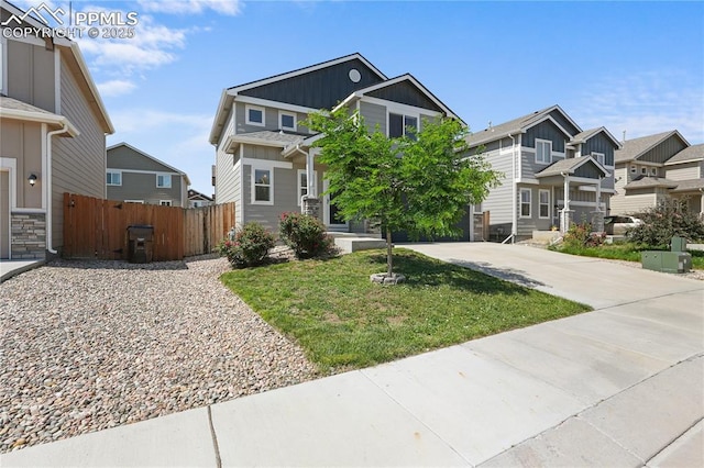 9744 Rubicon Dr, Colorado Springs, CO 80925 - craftsman-style home with a residential view, concrete driveway, and board and batten siding