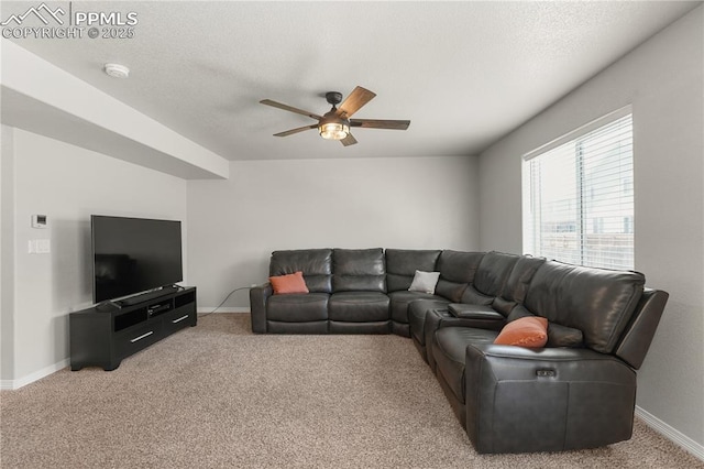 9744 Rubicon Dr, Colorado Springs, CO 80925 - carpeted living area featuring a ceiling fan and a textured ceiling