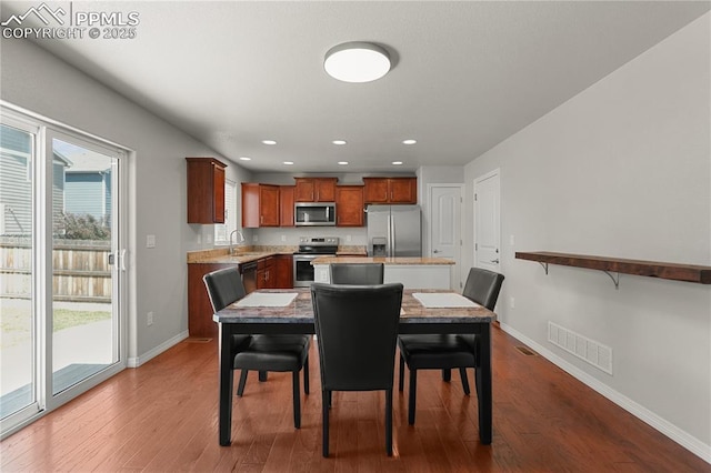 9744 Rubicon Dr, Colorado Springs, CO 80925 - dining space featuring dark wood-style flooring and recessed lighting