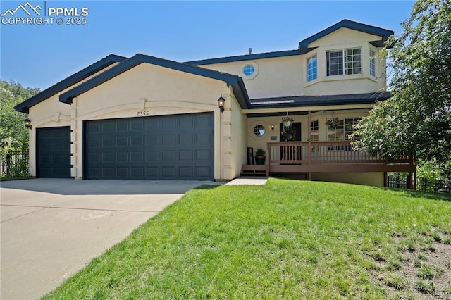2355 Sawgrass Ct, Colorado Springs, CO 80907 - view of front of home with a garage, stucco siding, a front yard, concrete driveway, and a porch