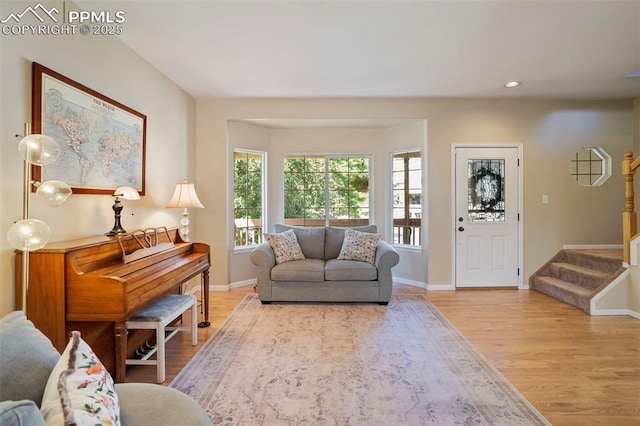 2355 Sawgrass Ct, Colorado Springs, CO 80907 - living area with light wood-style flooring, stairs, and recessed lighting