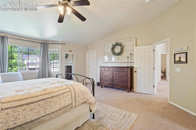 2355 Sawgrass Ct, Colorado Springs, CO 80907 - bedroom with vaulted ceiling, light carpet, and a ceiling fan