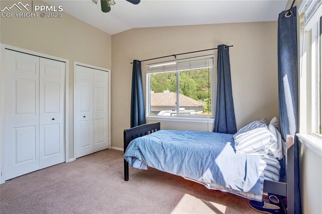 2355 Sawgrass Ct, Colorado Springs, CO 80907 - bedroom featuring vaulted ceiling, two closets, and carpet