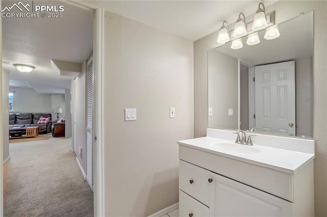 2355 Sawgrass Ct, Colorado Springs, CO 80907 - bathroom featuring vanity and a textured wall
