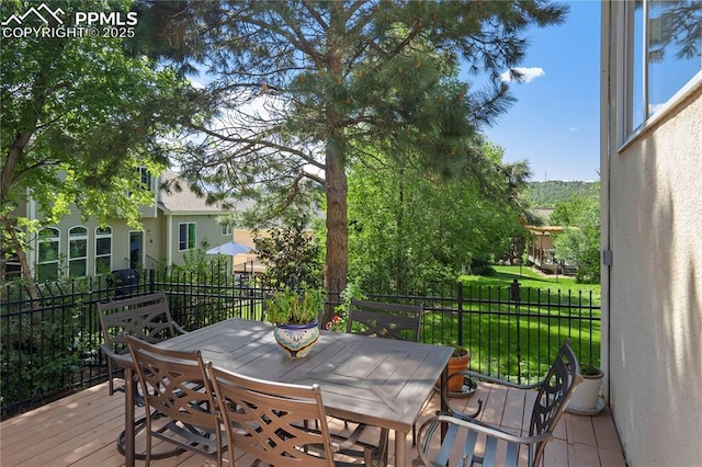 2355 Sawgrass Ct, Colorado Springs, CO 80907 - wooden deck with outdoor dining area
