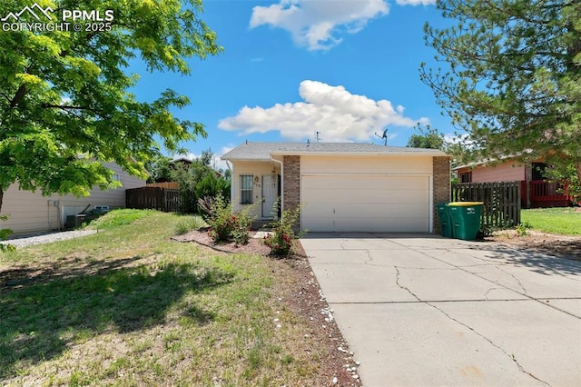 609 Wheat Field Rd, Fountain, CO 80817 - ranch-style home featuring concrete driveway, a garage, and brick siding
