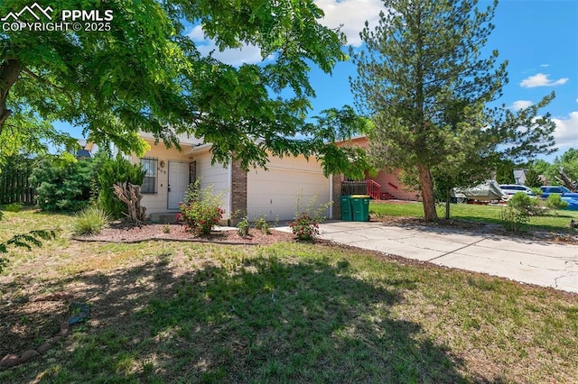 609 Wheat Field Rd, Fountain, CO 80817 - view of front of property with a garage, driveway, and a front yard