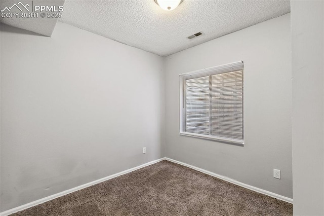 609 Wheat Field Rd, Fountain, CO 80817 - carpeted spare room with a textured ceiling and baseboards